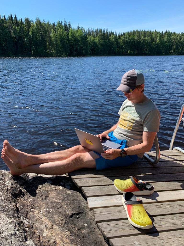 TX CEO Jarmo Suoranta working as a digital nomad by a Finnish lake.